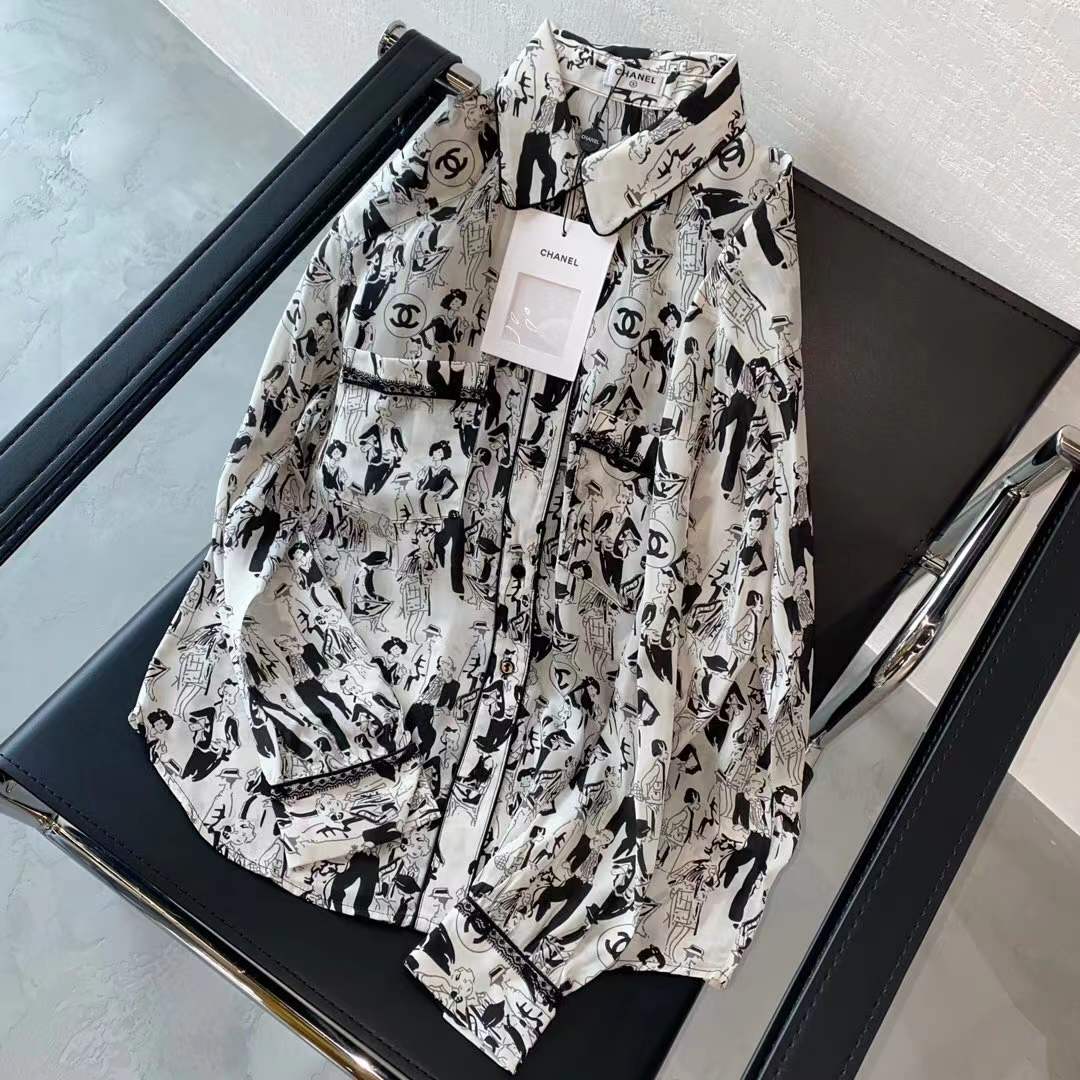 Channel white and black printed shirt featuring a classic collar and button closure