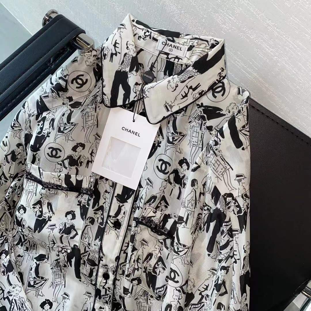 Channel white and black printed shirt featuring a classic collar and button closure