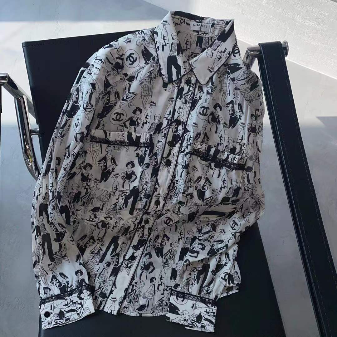 Channel white and black printed shirt featuring a classic collar and button closure
