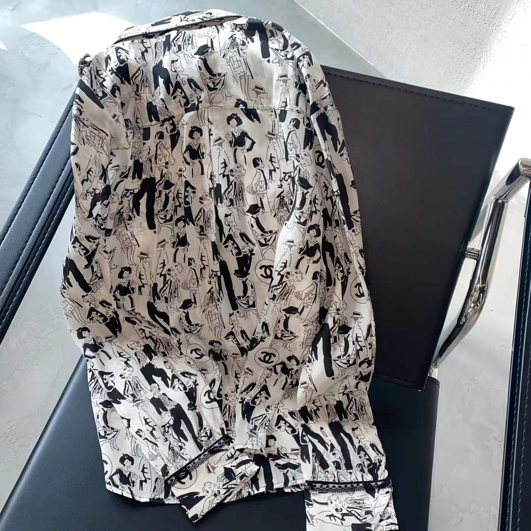 Channel white and black printed shirt featuring a classic collar and button closure