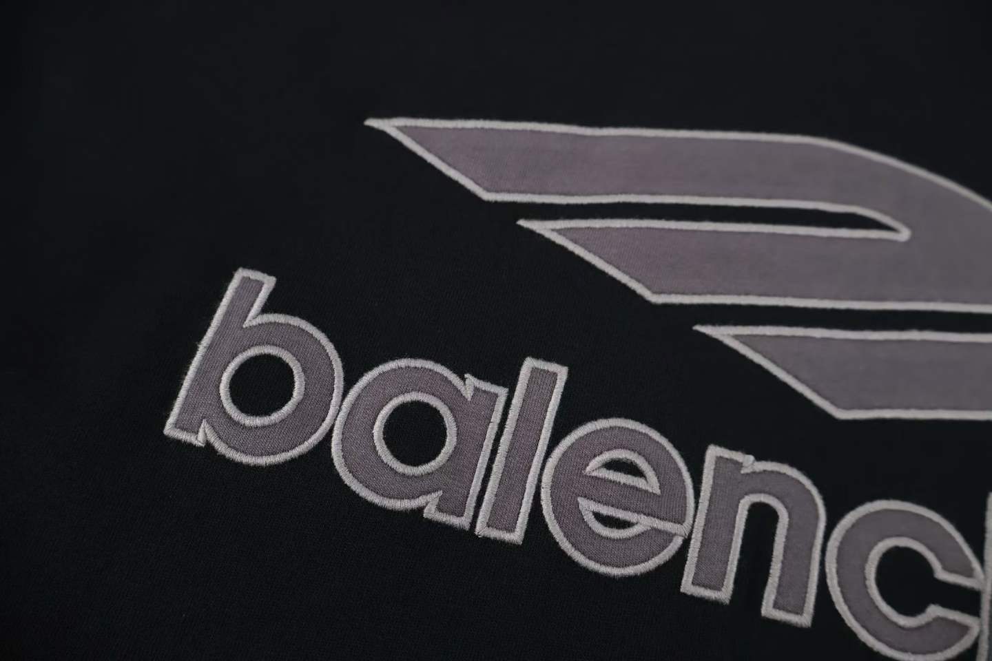 Balenciaga 3B Football V-Neck T-shirt Oversized in dark navy and red dry jersey.