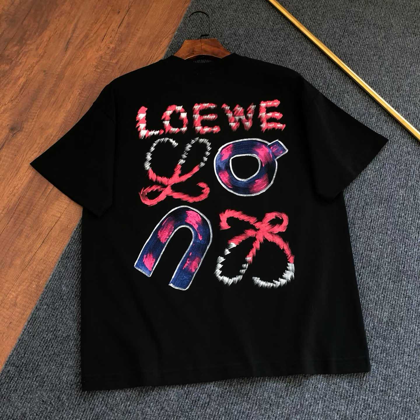 loewe black oversized crew neck t-shirt with a colorful graphic print