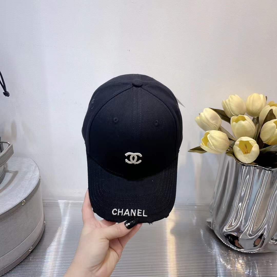Chanel baseball cap classic interlocking 'CC' logo and a "CHANEL" text embroidery
