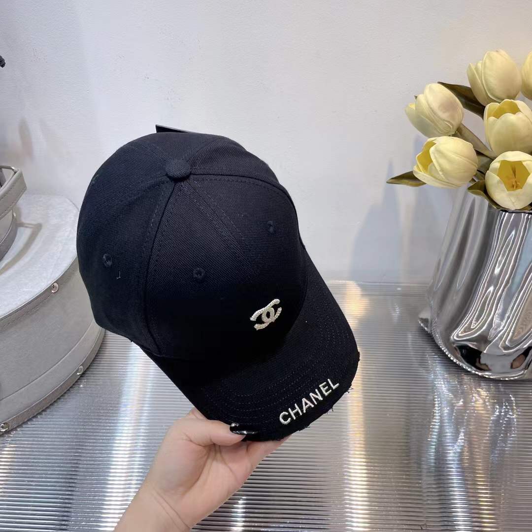 Chanel baseball cap classic interlocking 'CC' logo and a "CHANEL" text embroidery