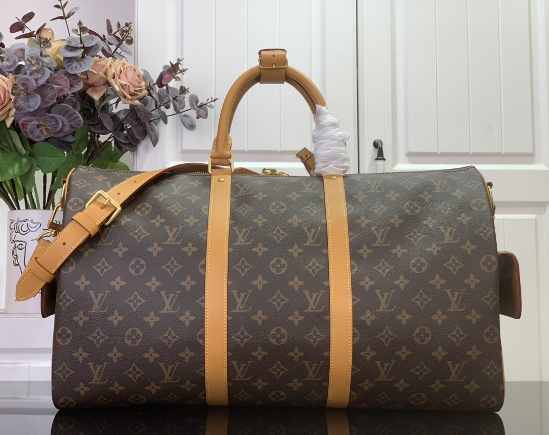 LV Keepall Cargo 50 bag in Monogram coated canvas with natural-cowhide trim and golden hardware.