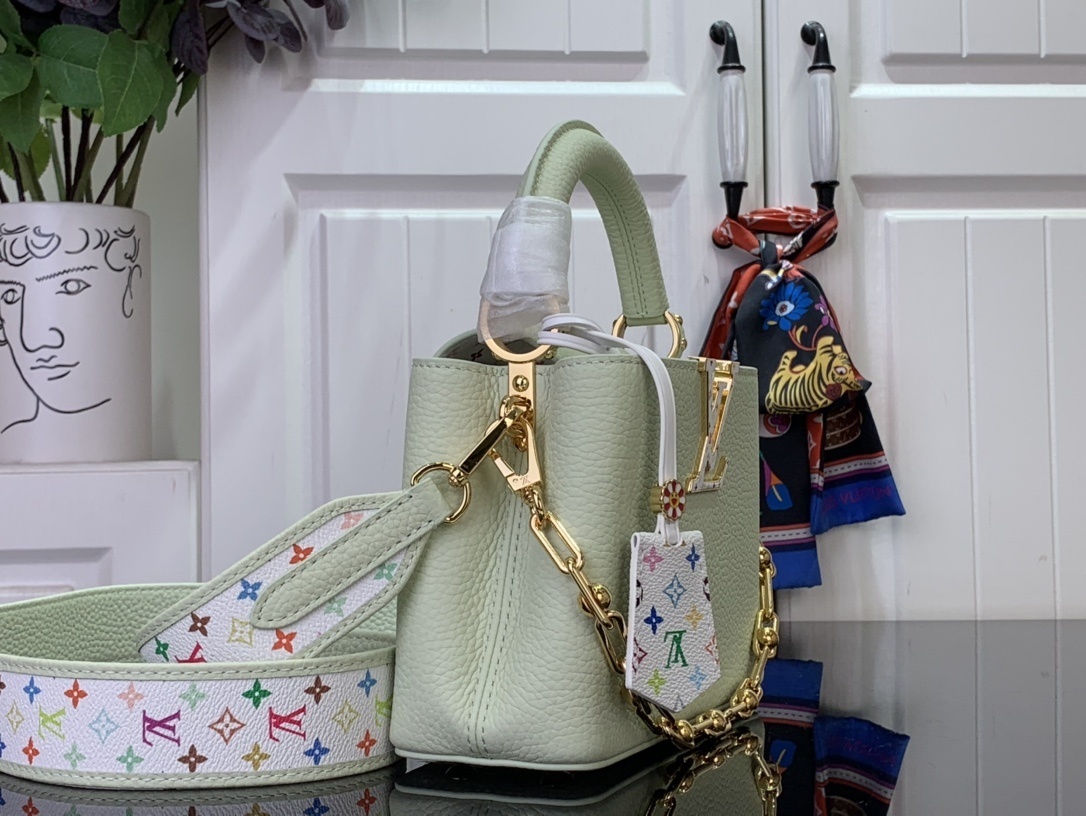 LV x Takashi Murakami Capucines Mini handbag in green Taurillon leather with a multicolor monogram flower tag and an enameled chain strap