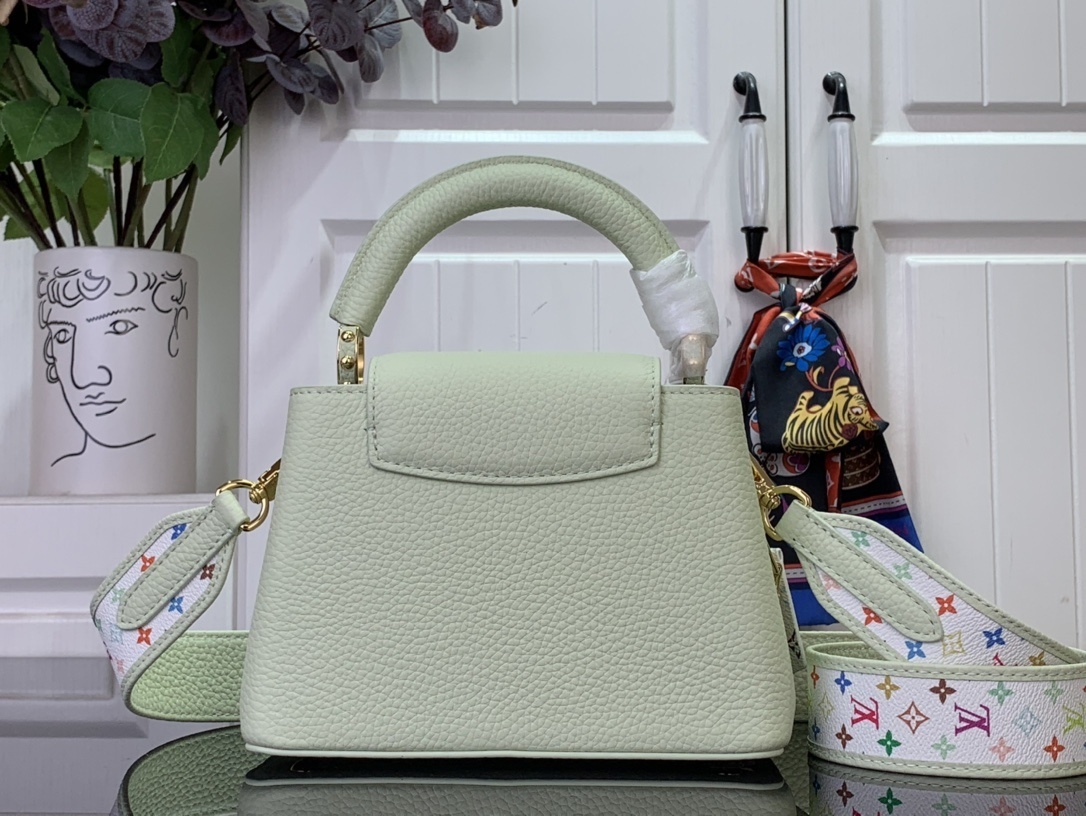 LV x Takashi Murakami Capucines Mini handbag in green Taurillon leather with a multicolor monogram flower tag and an enameled chain strap