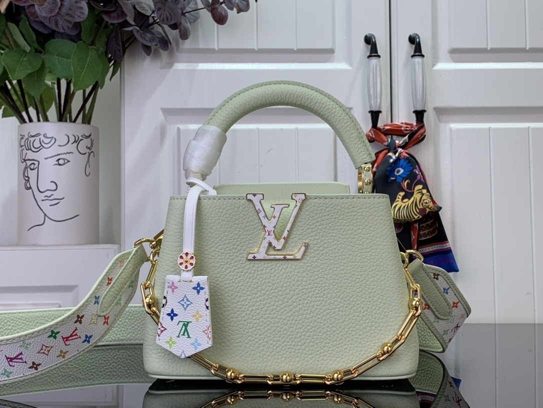 LV x Takashi Murakami Capucines Mini handbag in green Taurillon leather with a multicolor monogram flower tag and an enameled chain strap