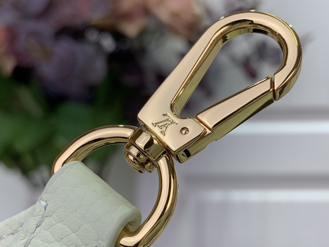 LV x Takashi Murakami Capucines Mini handbag in green Taurillon leather with a multicolor monogram flower tag and an enameled chain strap