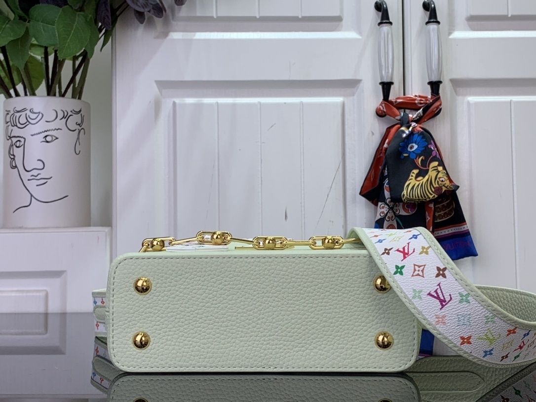 LV x Takashi Murakami Capucines Mini handbag in green Taurillon leather with a multicolor monogram flower tag and an enameled chain strap