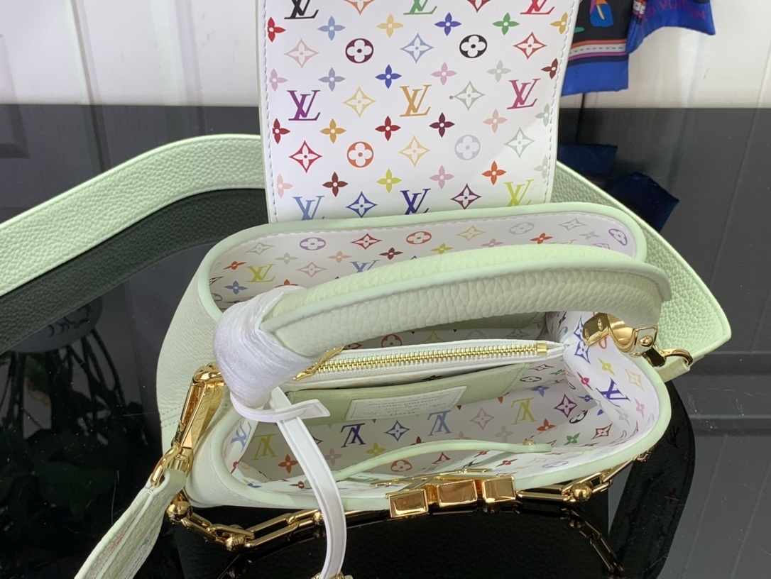 LV x Takashi Murakami Capucines Mini handbag in green Taurillon leather with a multicolor monogram flower tag and an enameled chain strap