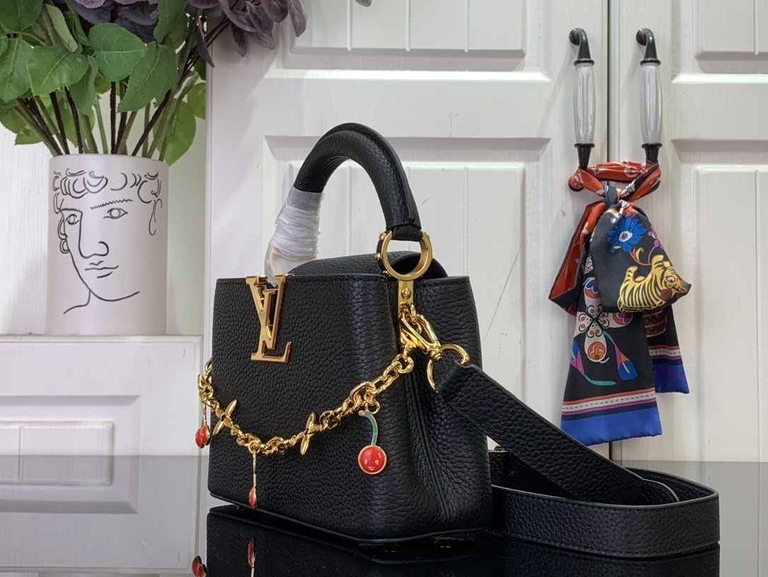 LV x Takashi Murakami Cherry Capucines MM handbag in black Taurillon leather.