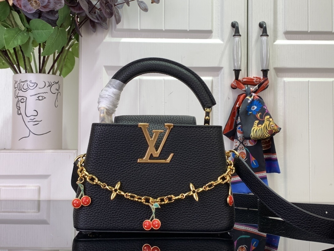LV x Takashi Murakami Cherry Capucines MM handbag in black Taurillon leather.