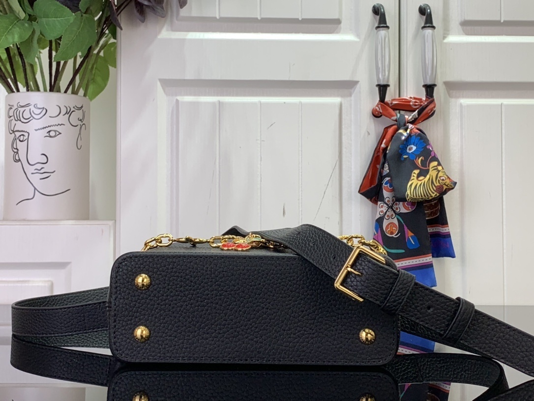 LV x Takashi Murakami Cherry Capucines MM handbag in black Taurillon leather.