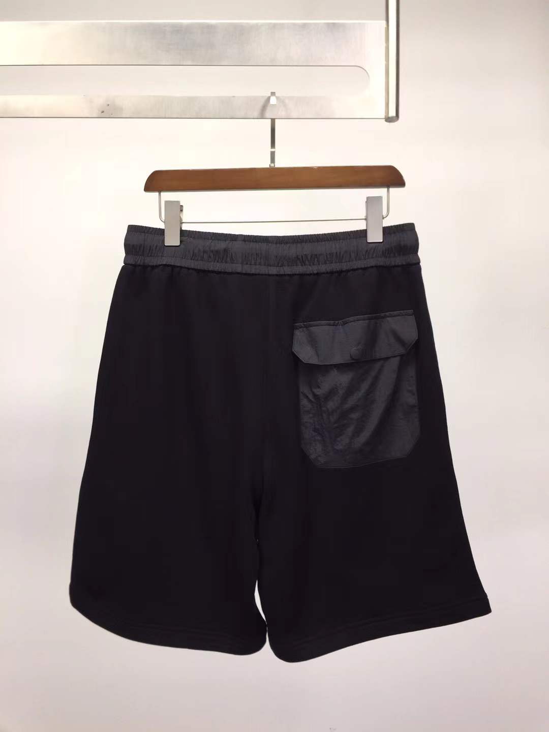 Givenchy black cotton or fleece blend shorts with an elasticated drawstring waistband and a logo print on the leg