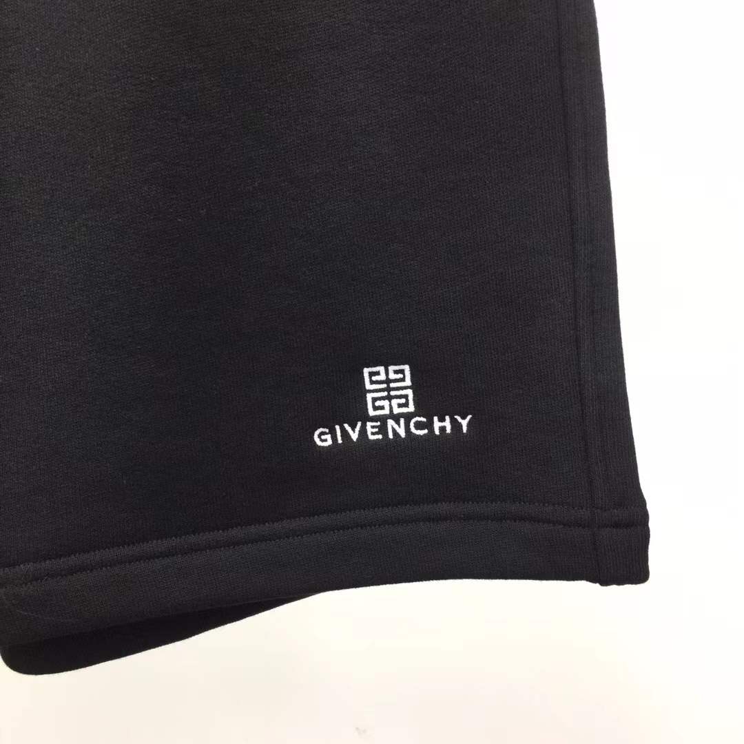 Givenchy black cotton or fleece blend shorts with an elasticated drawstring waistband and a logo print on the leg
