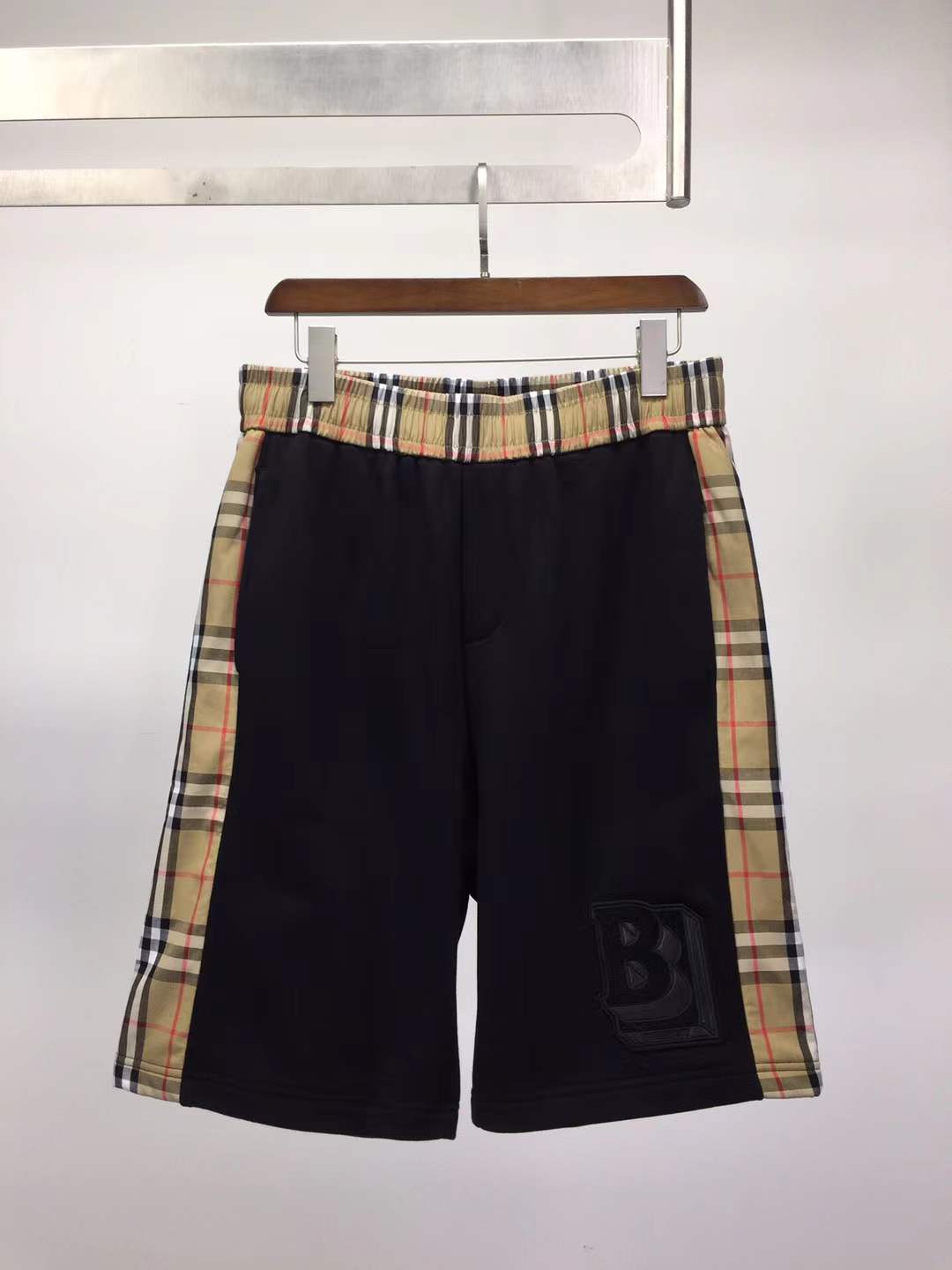 Burberry Kids black loopback cotton shorts with check side taping and an embroidered Equestrian Knight Design logo