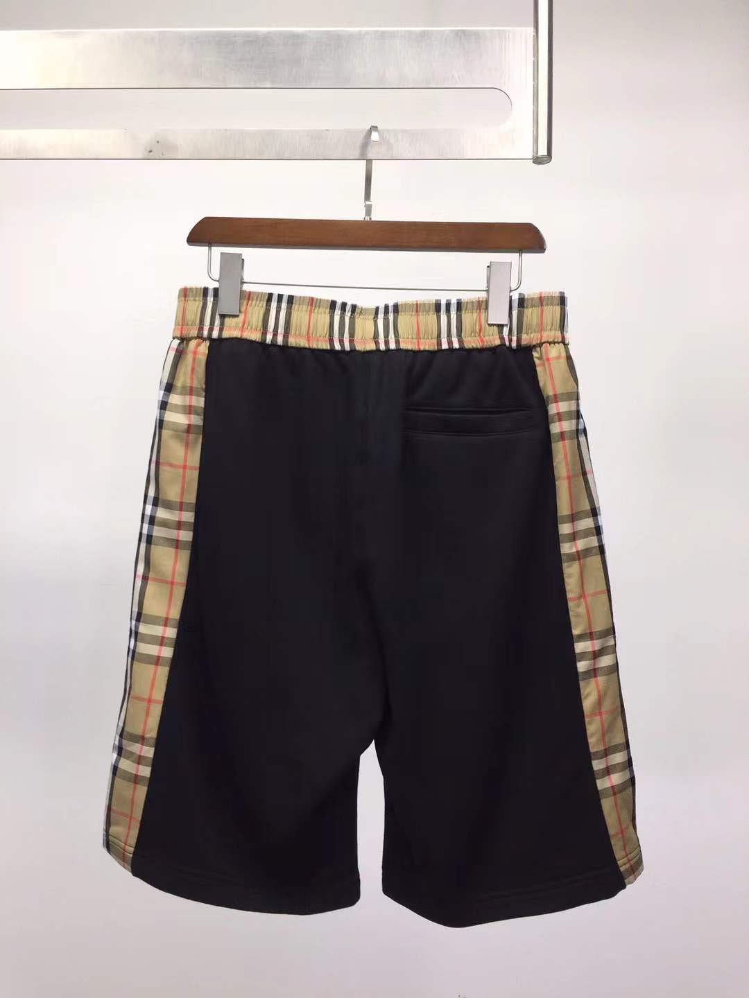 Burberry Kids black loopback cotton shorts with check side taping and an embroidered Equestrian Knight Design logo
