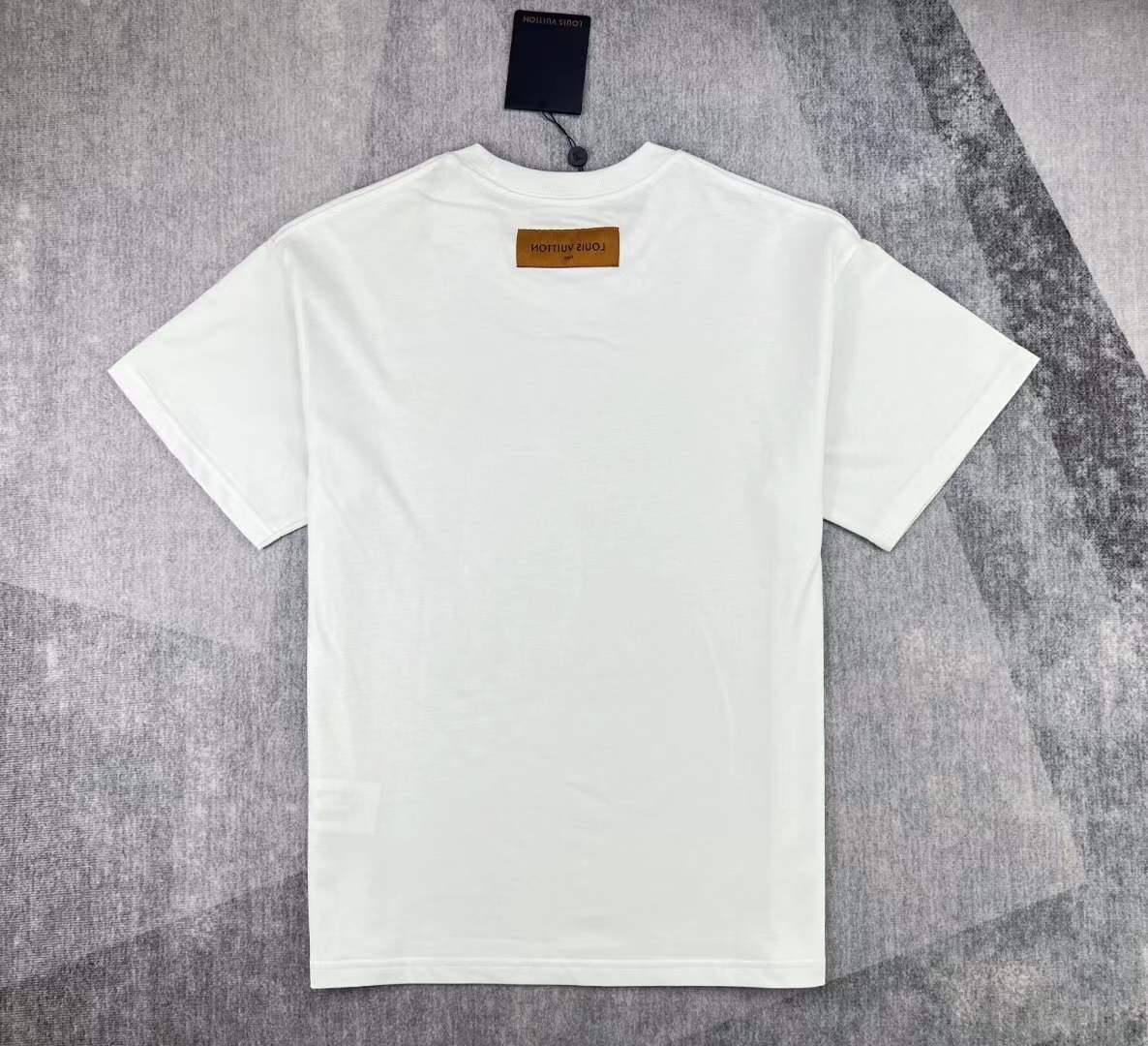 LV men's white t-shirt a green teddy bear graphic with the brand's Damier motif