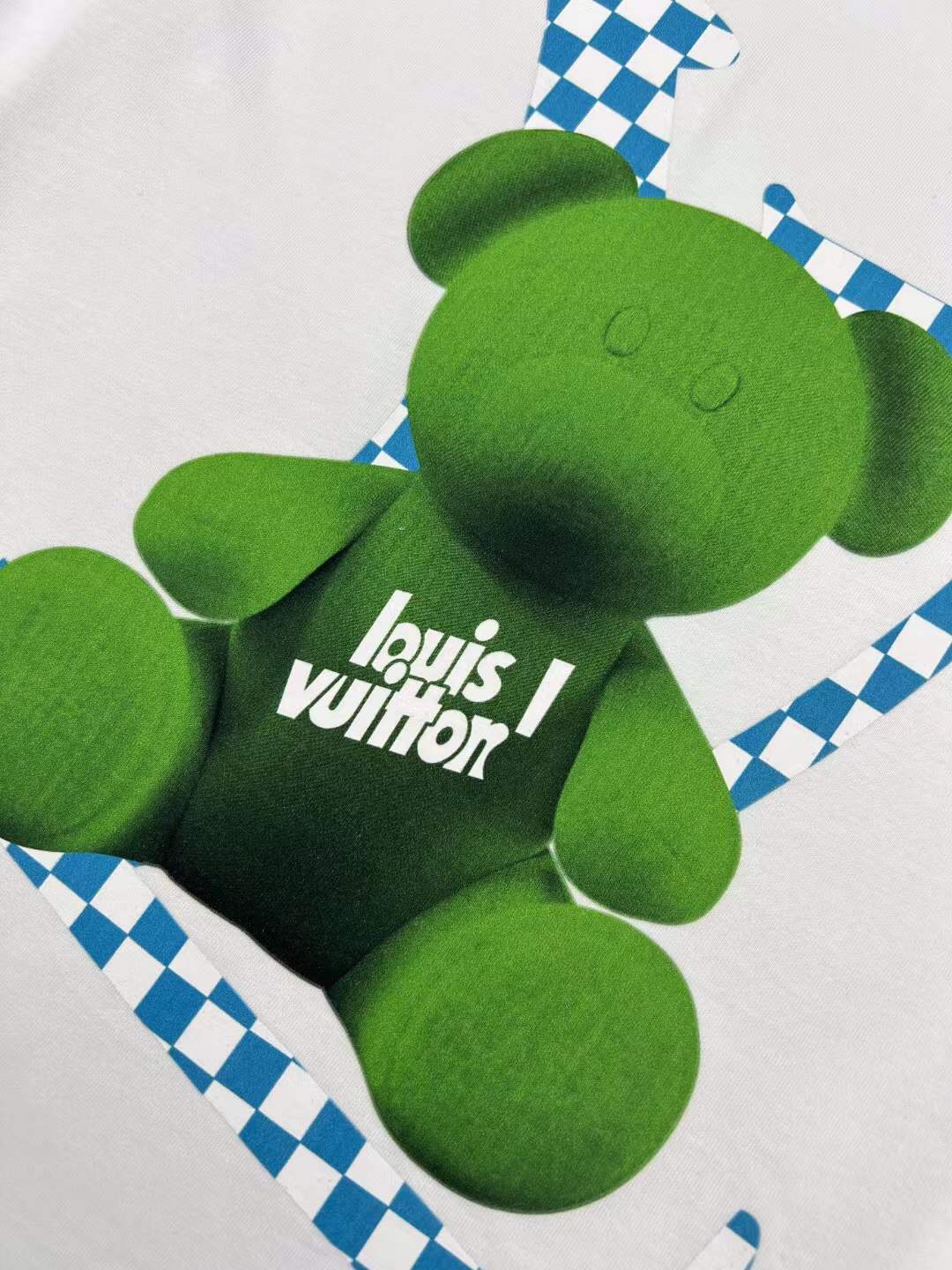 LV men's white t-shirt a green teddy bear graphic with the brand's Damier motif