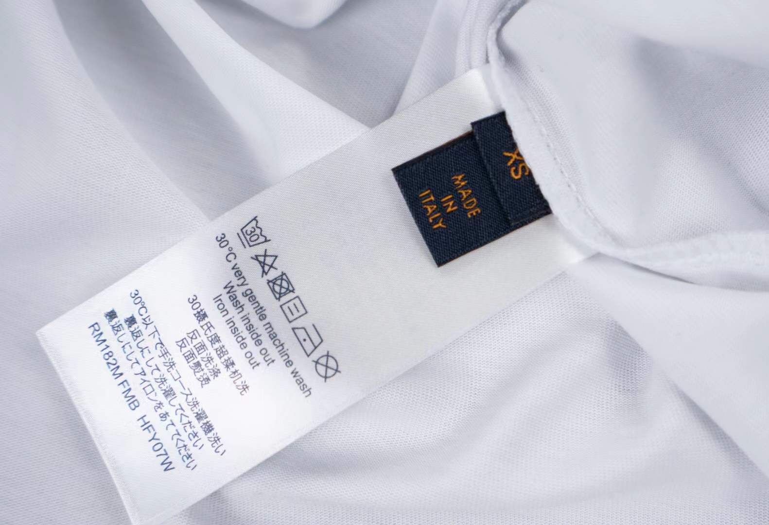 LV men's white t-shirt a green teddy bear graphic with the brand's Damier motif