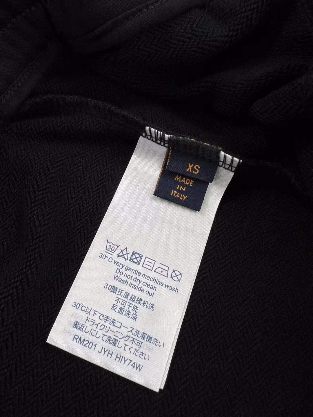 LV black shorts with green and yellow embroidered "L" and "V" patches