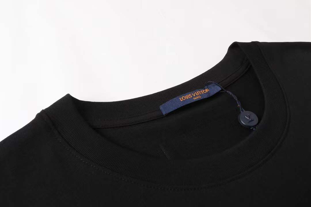 LV Glow Signature short sleeve youth blouse in black with a green LV logo