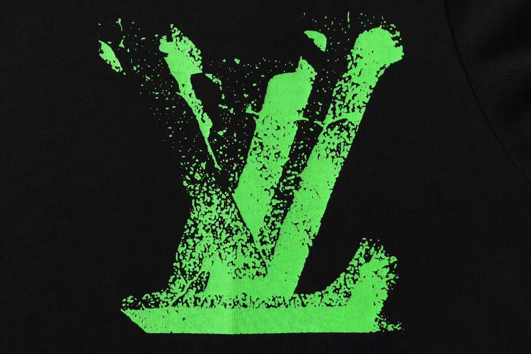 LV Glow Signature short sleeve youth blouse in black with a green LV logo