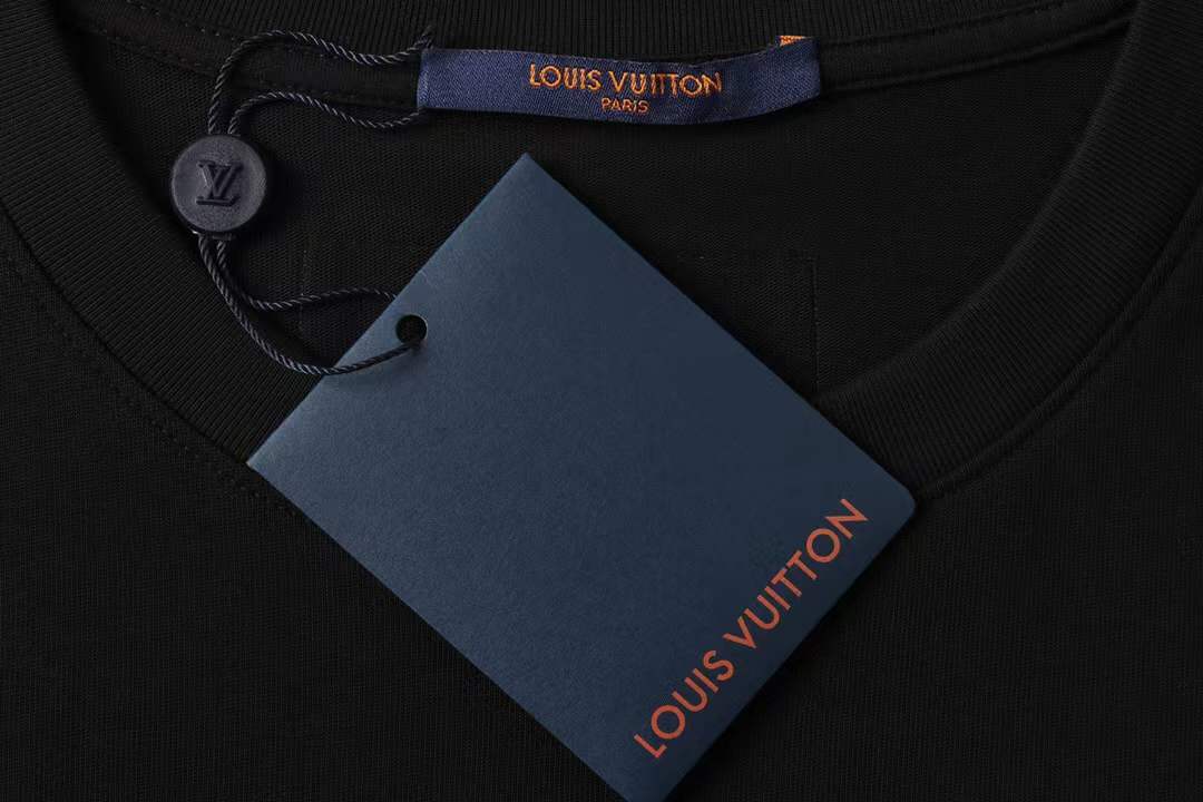 LV Glow Signature short sleeve youth blouse in black with a green LV logo