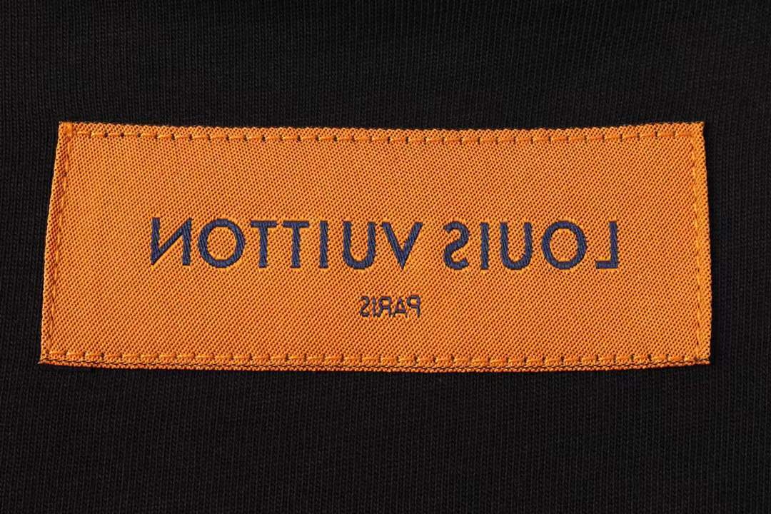 LV Glow Signature short sleeve youth blouse in black with a green LV logo