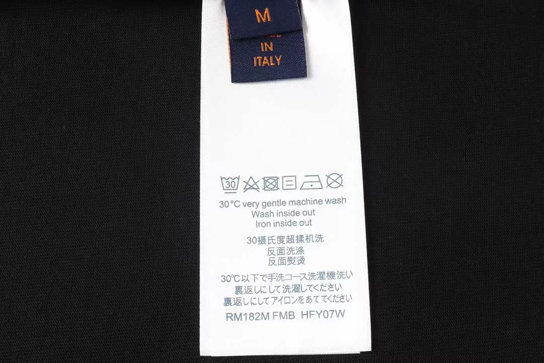 LV Glow Signature short sleeve youth blouse in black with a green LV logo