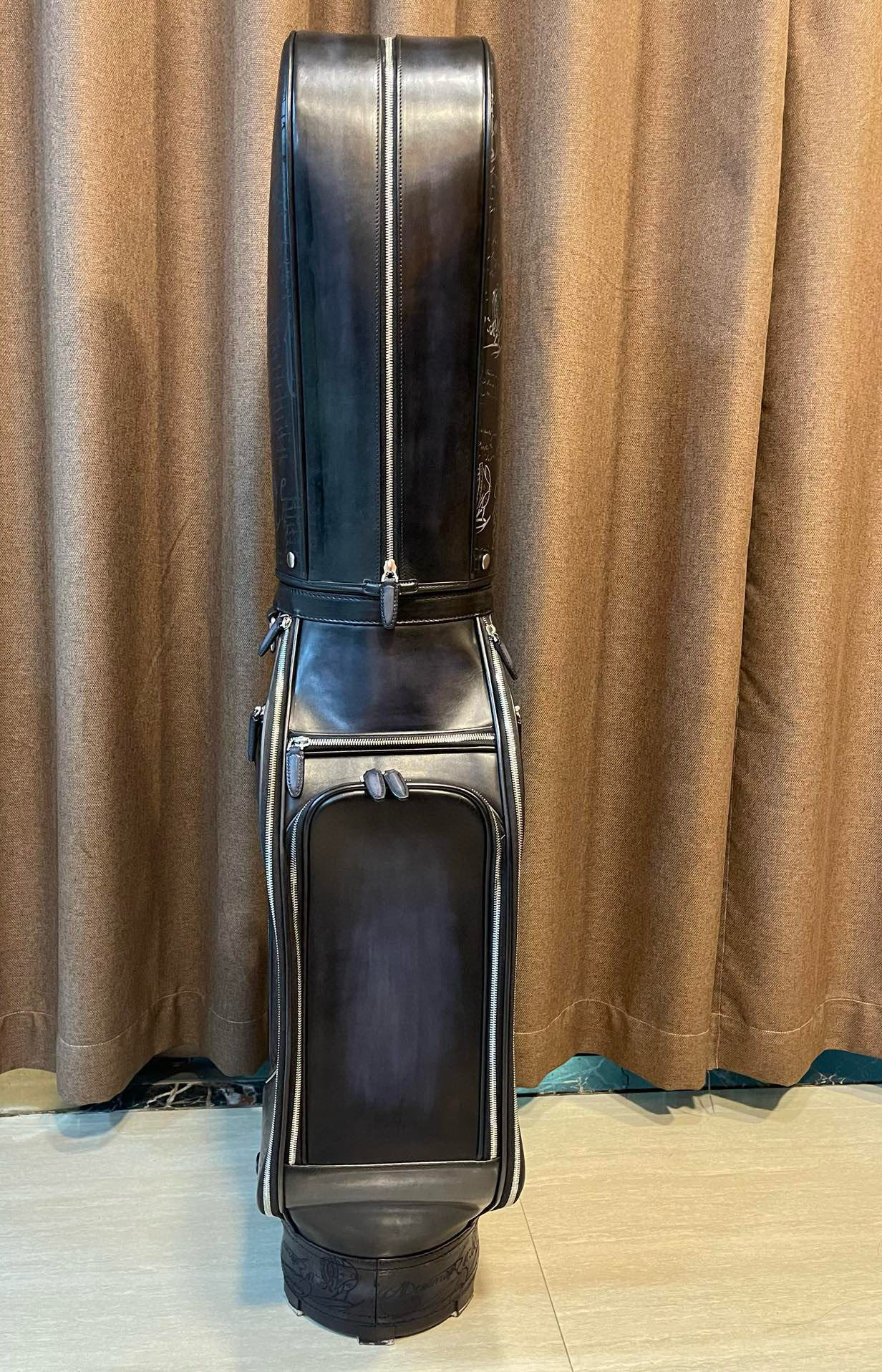 vintage Miller black leather golf bag with a carry strap