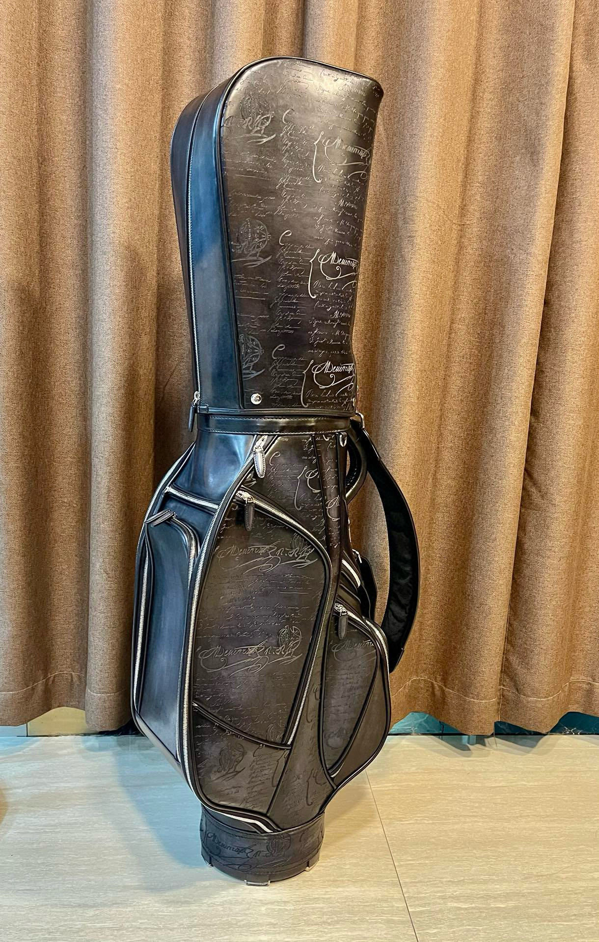 vintage Miller black leather golf bag with a carry strap