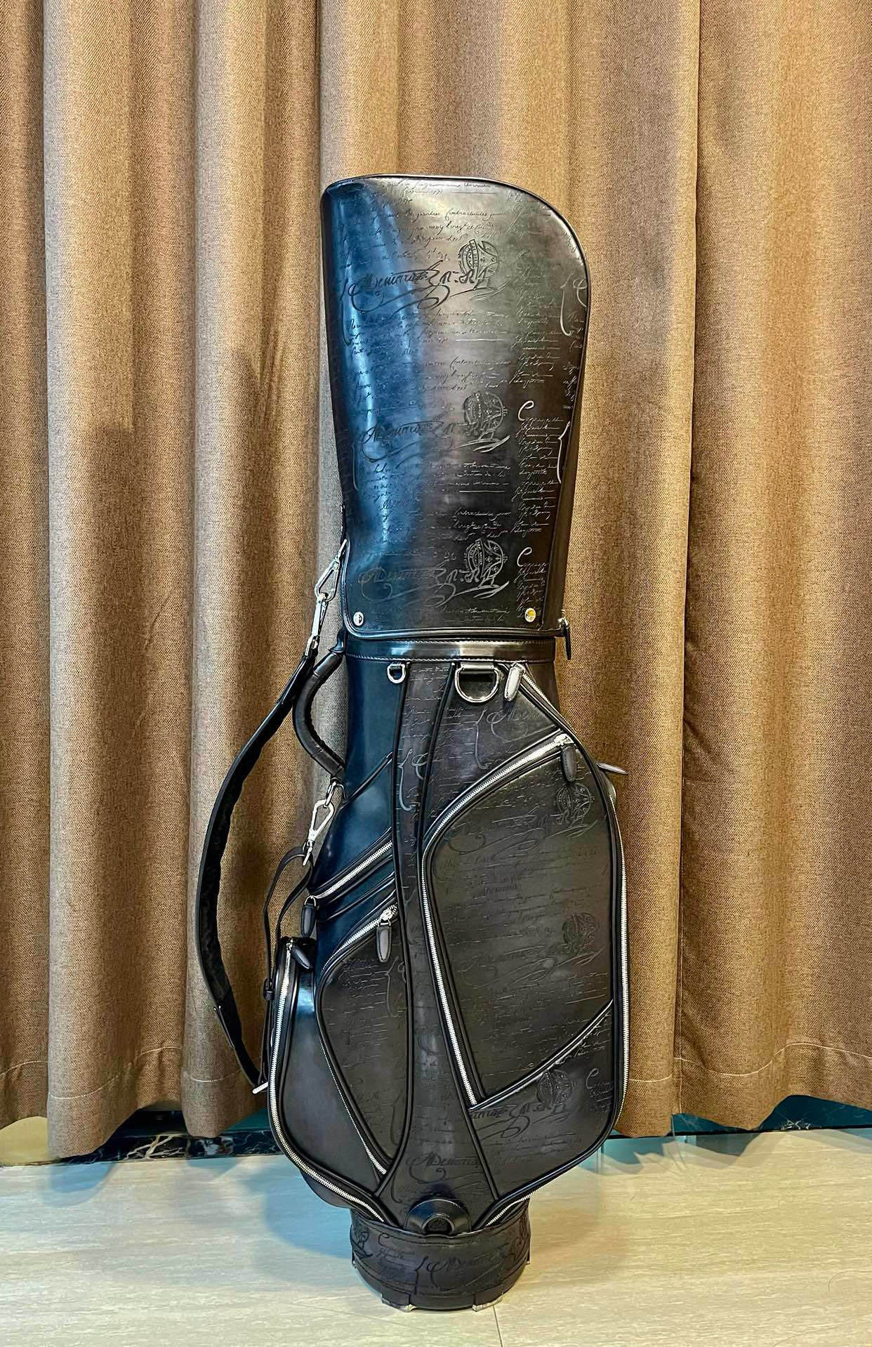 vintage Miller black leather golf bag with a carry strap