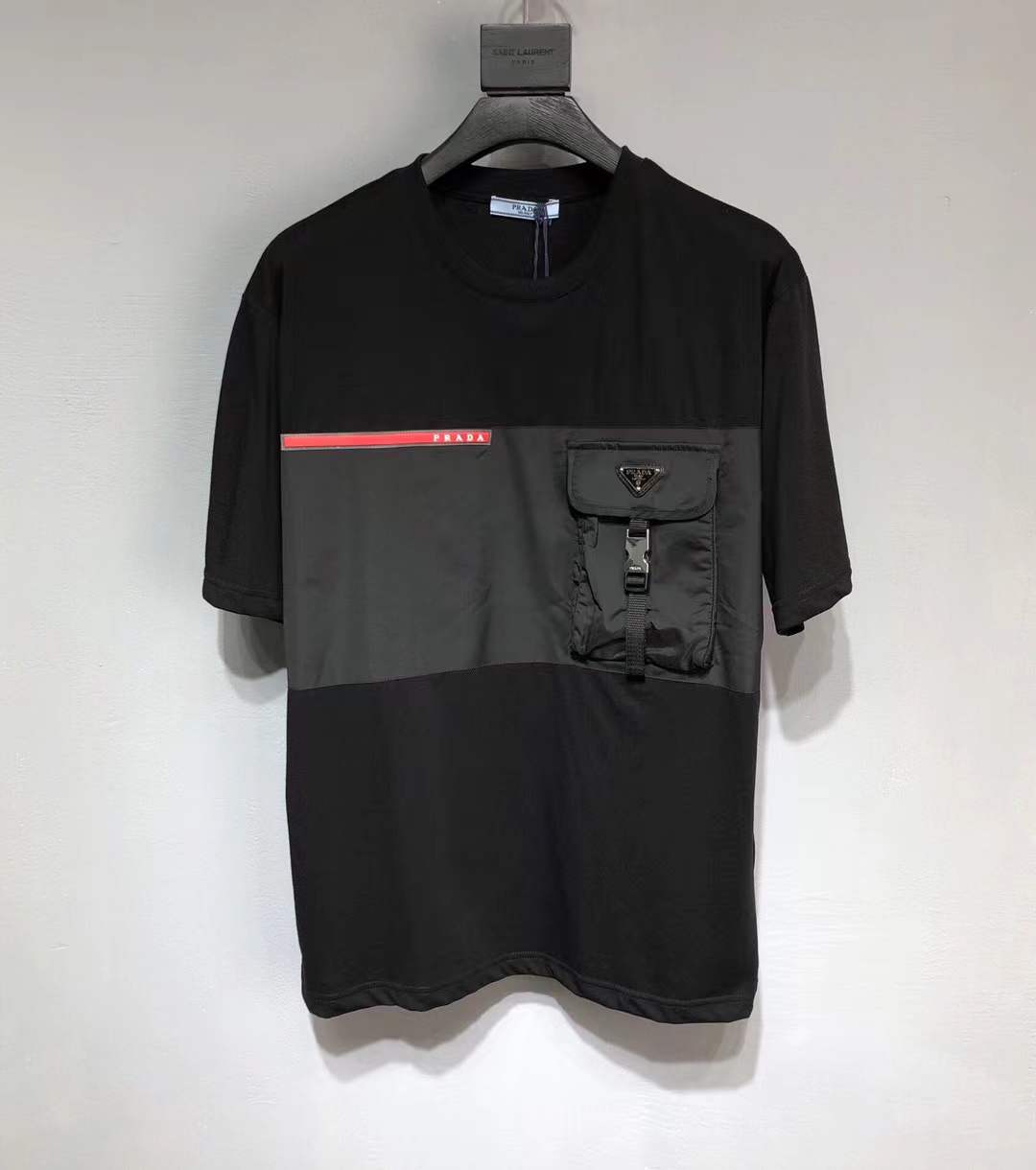 Prada Re-Nylon and jersey T-shirt black with a chest patch pocket and the signature enameled-metal triangle logo plaque.