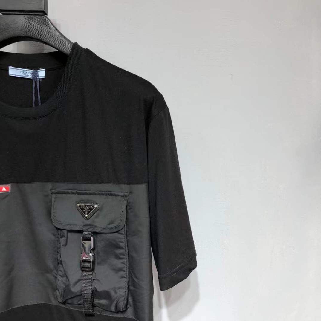 Prada Re-Nylon and jersey T-shirt black with a chest patch pocket and the signature enameled-metal triangle logo plaque.
