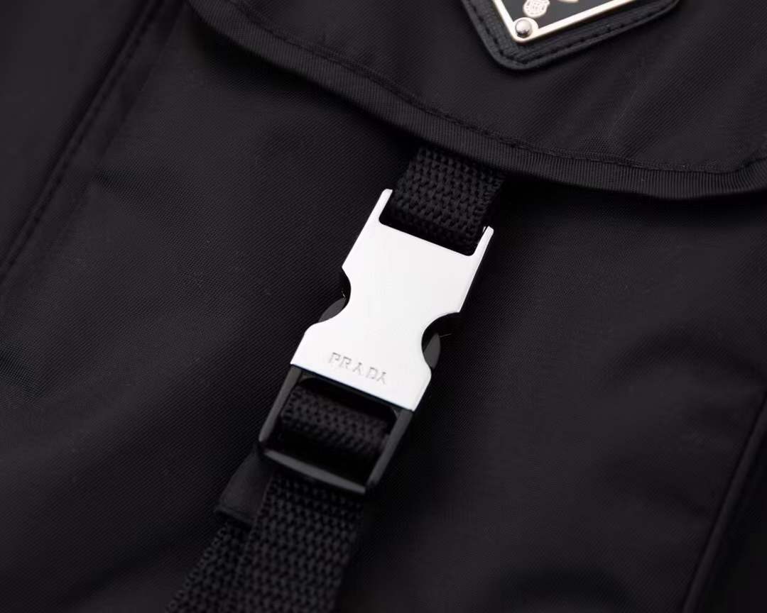 Prada Re-Nylon and jersey T-shirt black with a chest patch pocket and the signature enameled-metal triangle logo plaque.