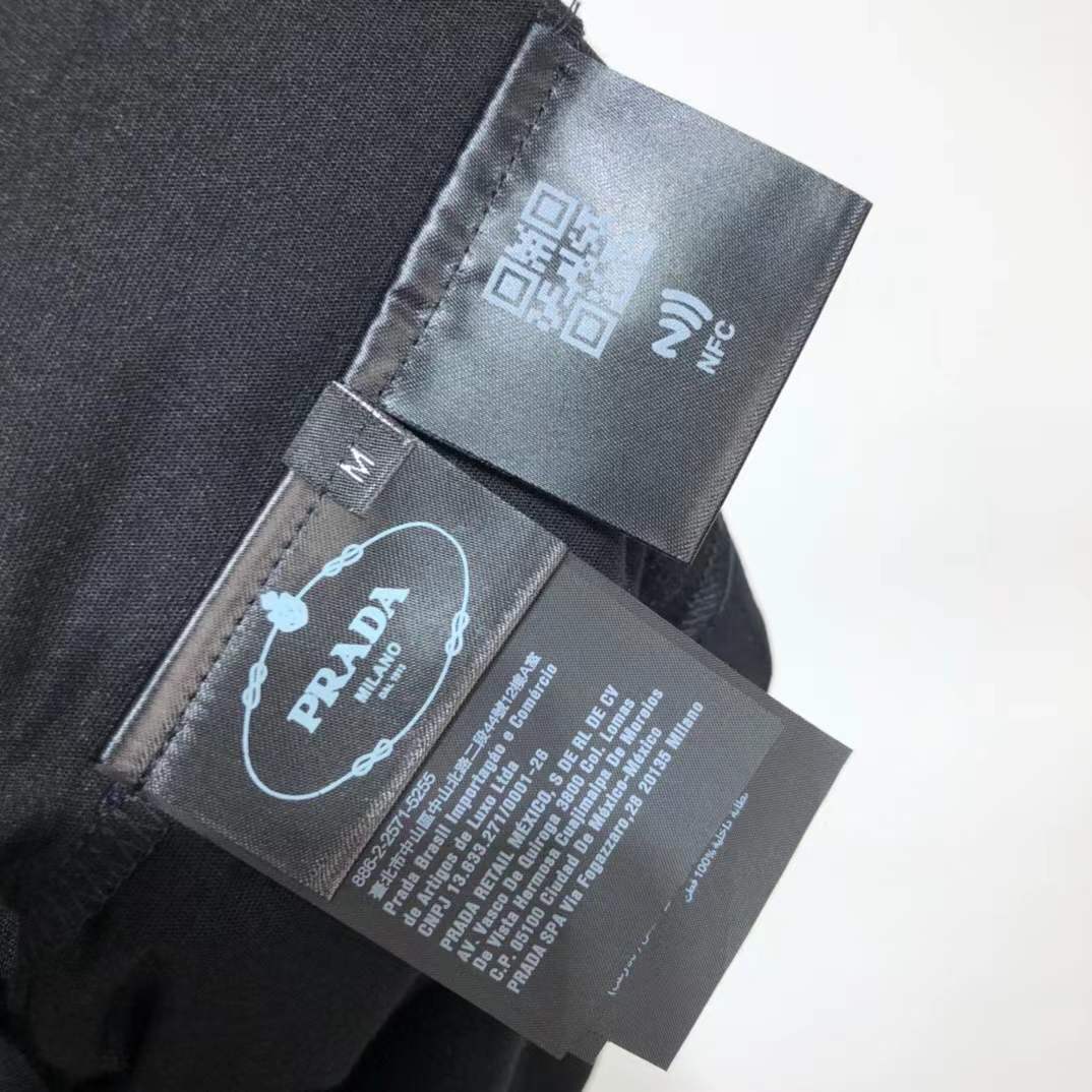 Prada Re-Nylon and jersey T-shirt black with a chest patch pocket and the signature enameled-metal triangle logo plaque.