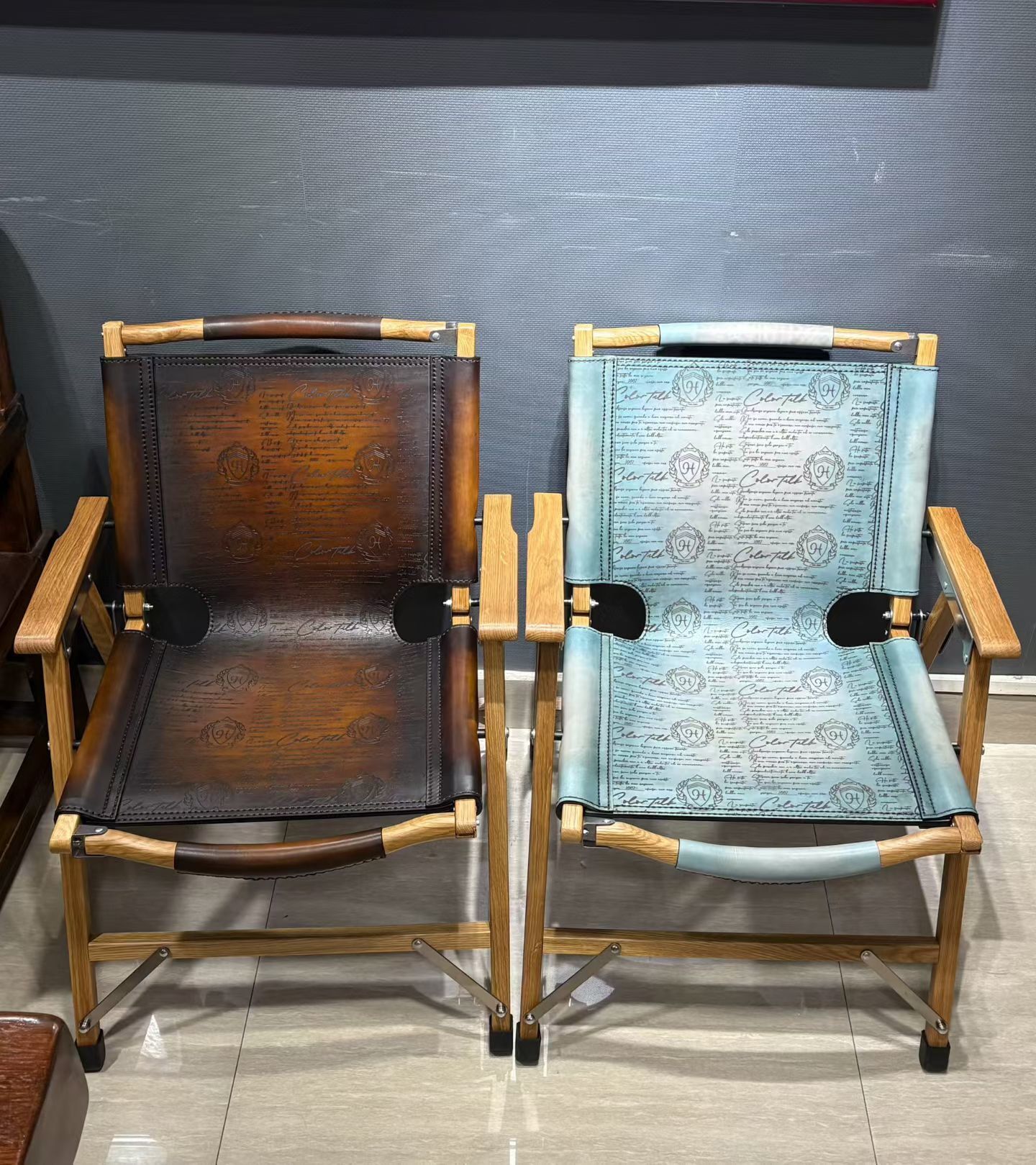 Berluti Metro wooden folding chair with a brown leather seat and backrest.