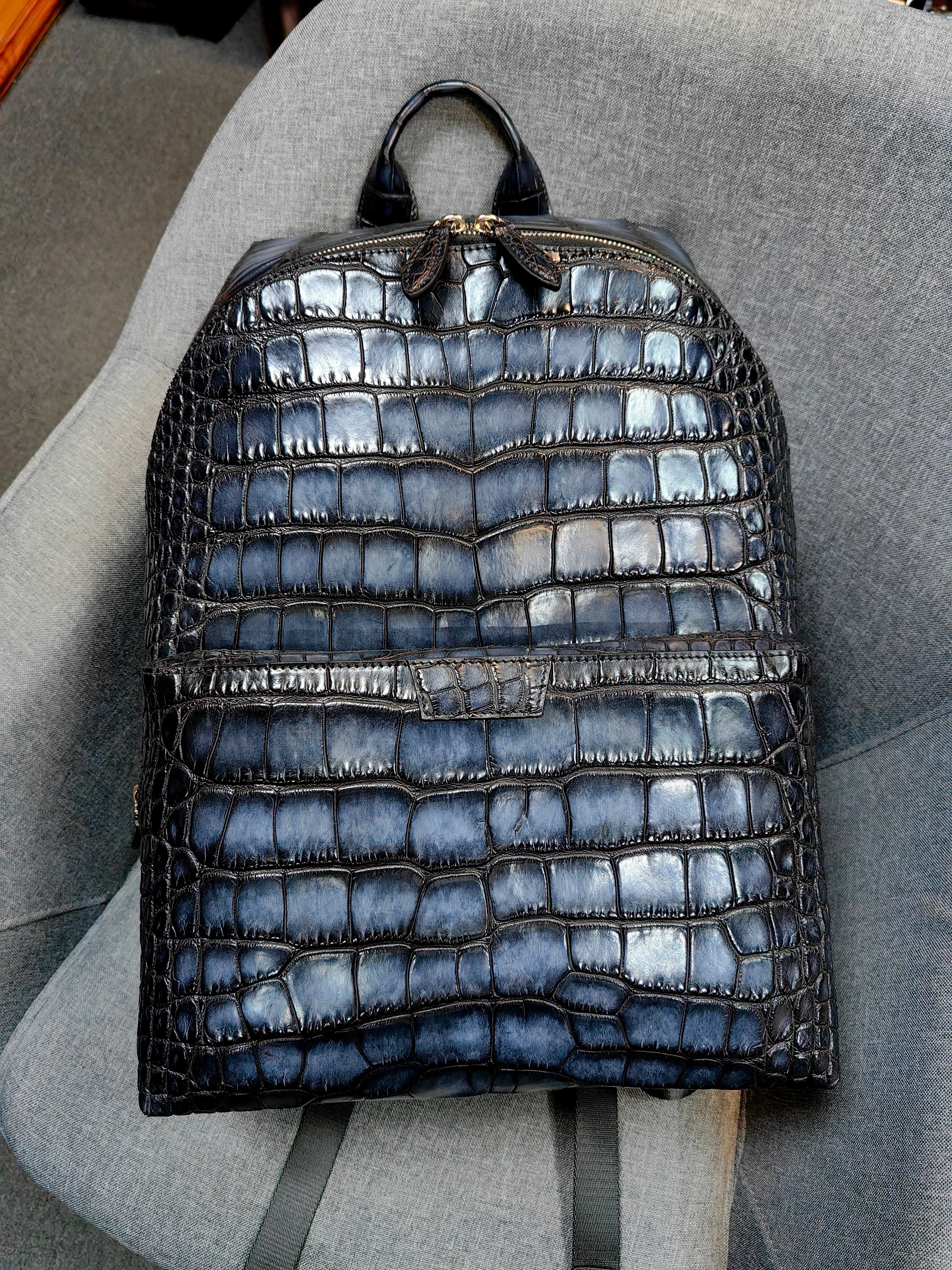 Berluti navy blue, crocodile-embossed leather backpack.