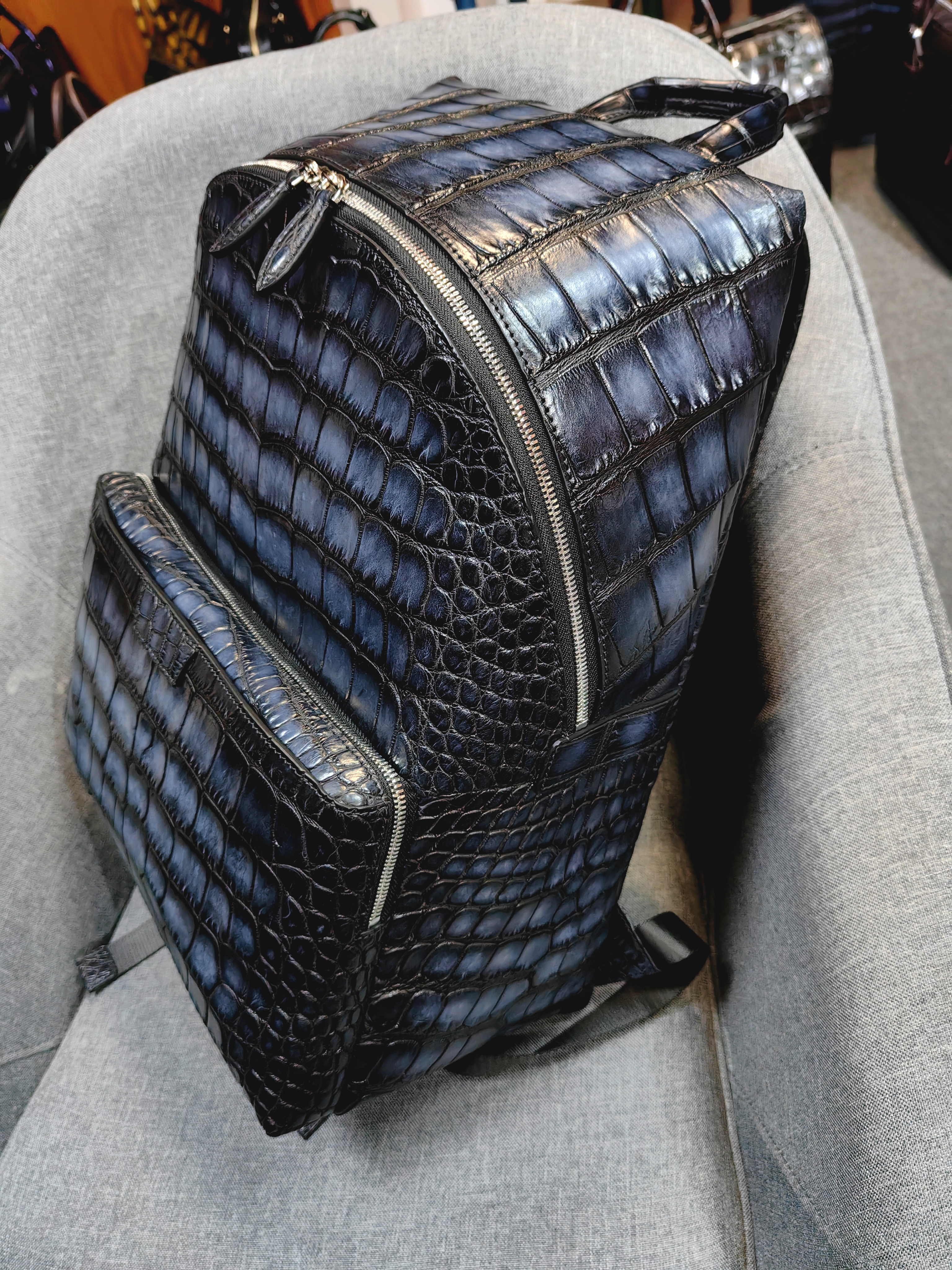 Berluti navy blue, crocodile-embossed leather backpack.