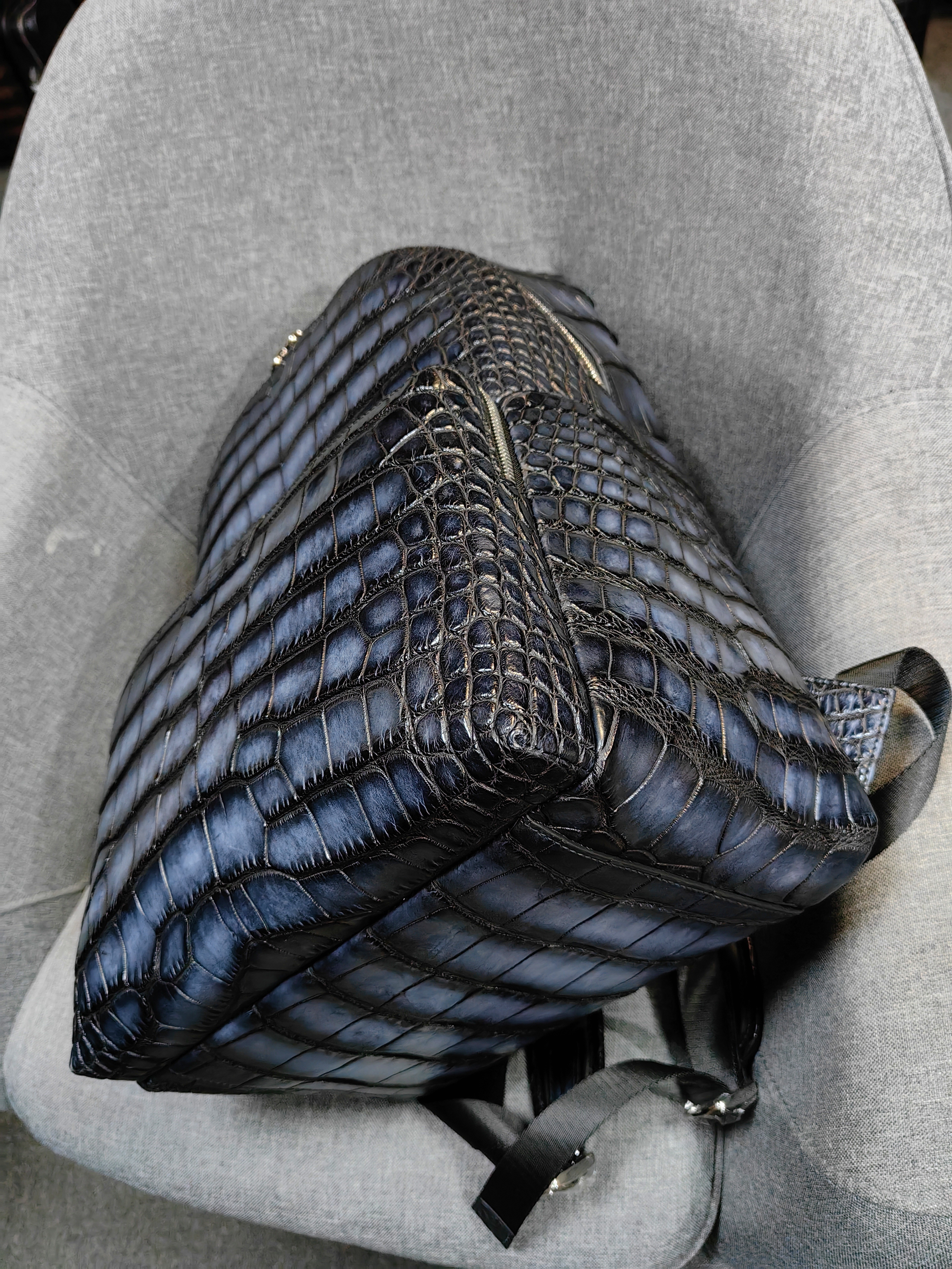 Berluti navy blue, crocodile-embossed leather backpack.