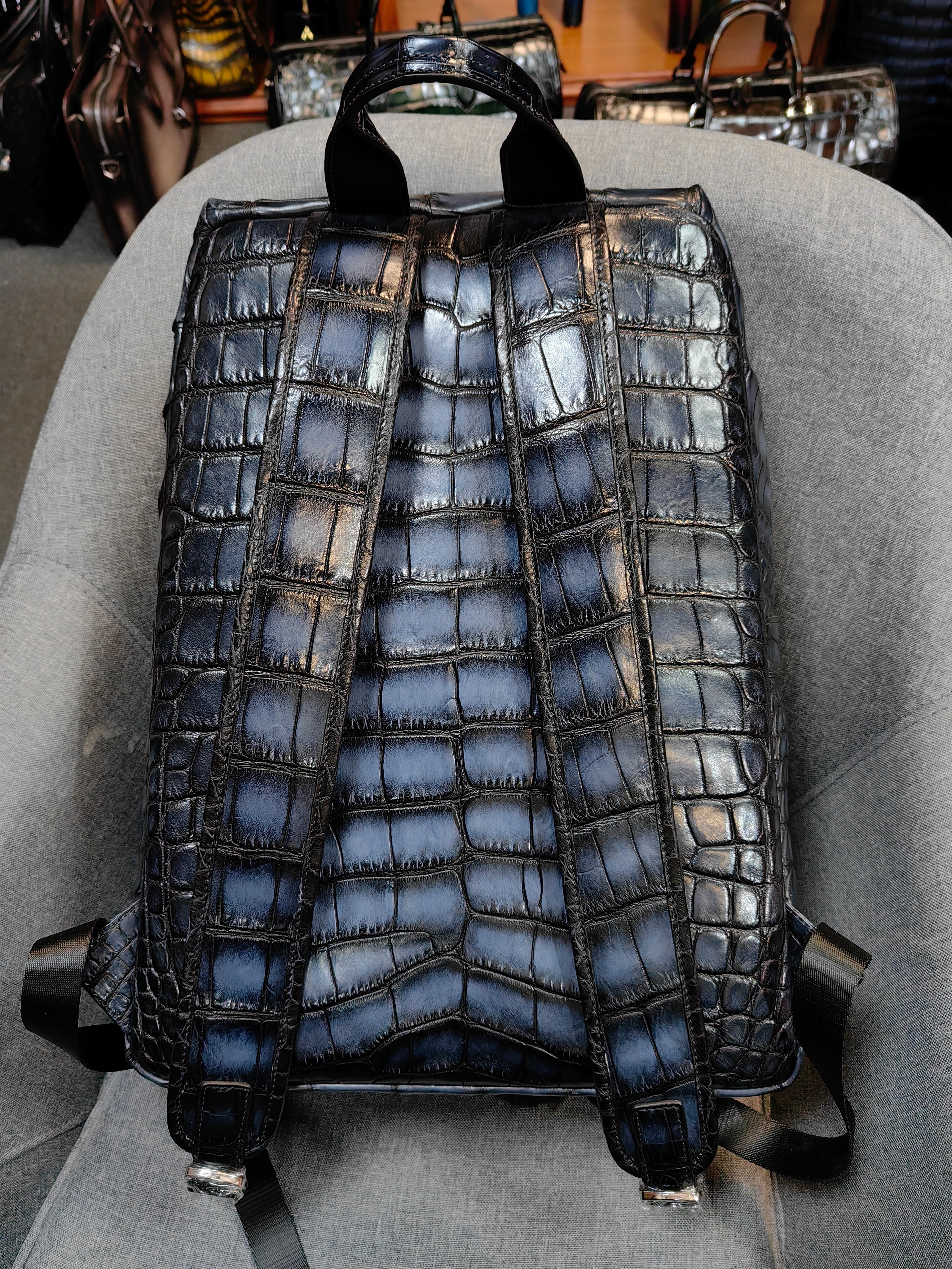 Berluti navy blue, crocodile-embossed leather backpack.