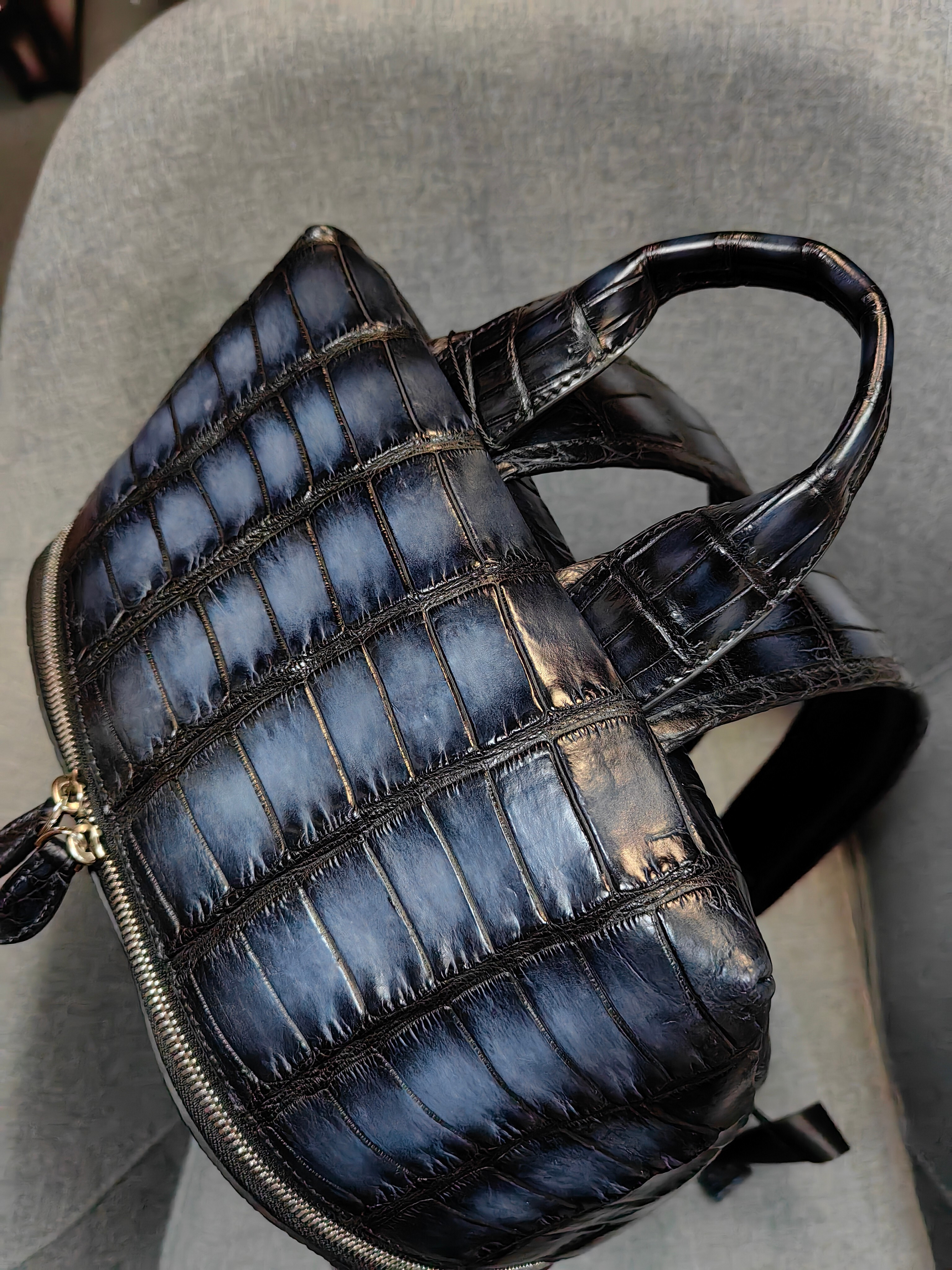 Berluti navy blue, crocodile-embossed leather backpack.