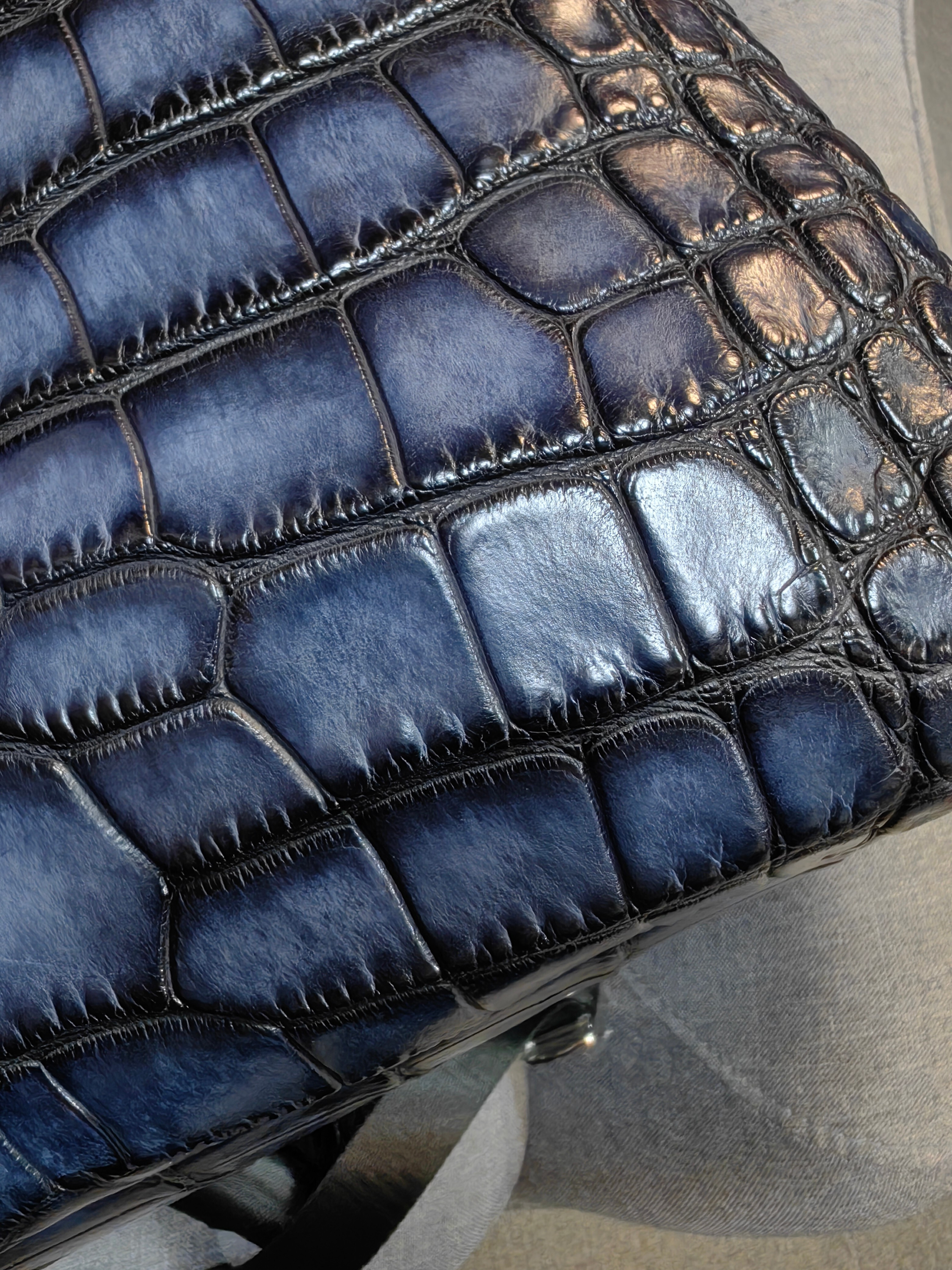 Berluti navy blue, crocodile-embossed leather backpack.