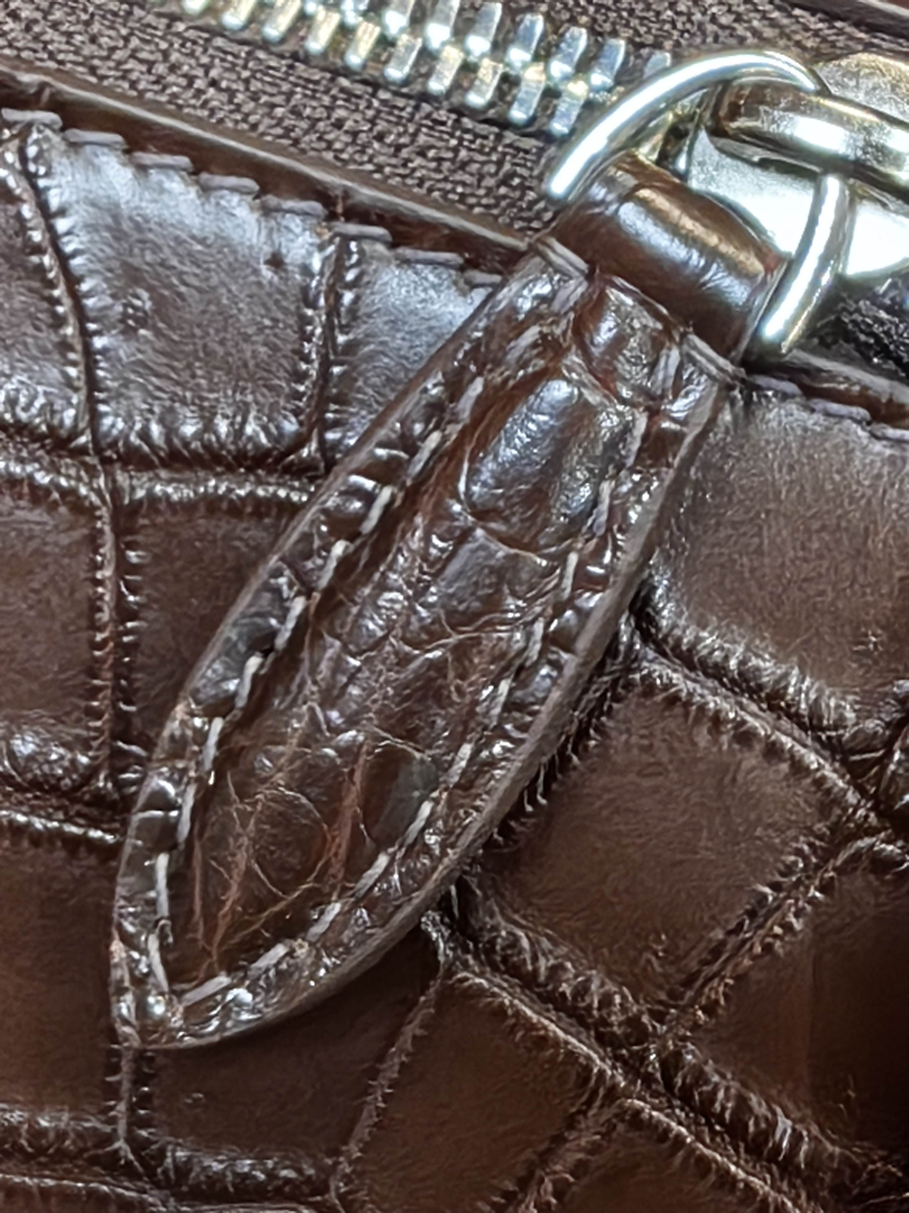 brown genuine leather backpack with a crocodile embossed texture
