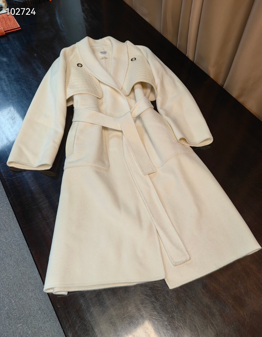 off-white Hermès belted coat with a detachable capelet
