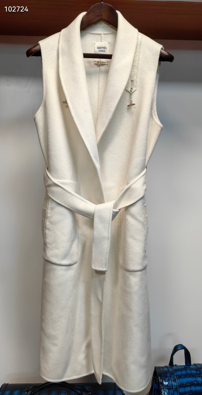 off-white Hermès belted coat with a detachable capelet