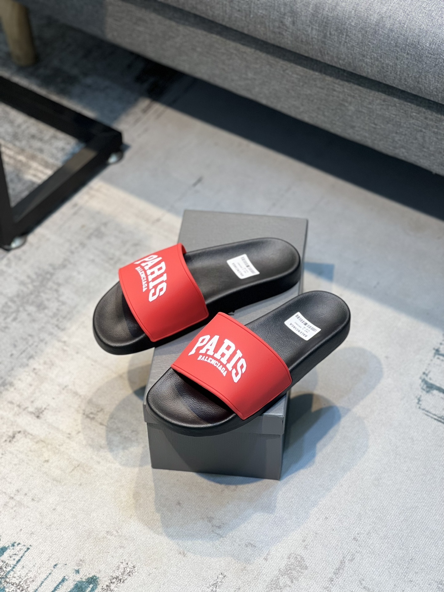 Balenciaga Cities Pool Slide sandals in black with red "PARIS" branding