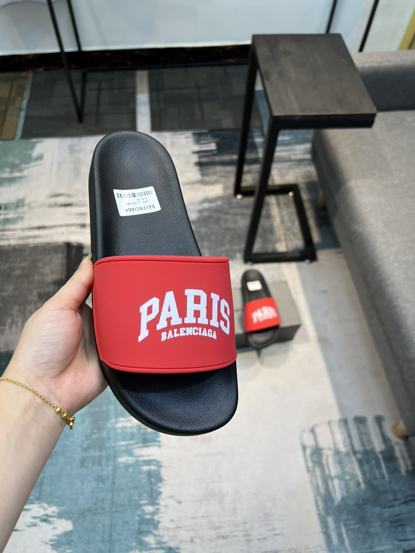 Balenciaga Cities Pool Slide sandals in black with red "PARIS" branding
